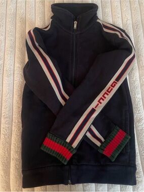 Gucci Black Garment Tag on Navy Background
